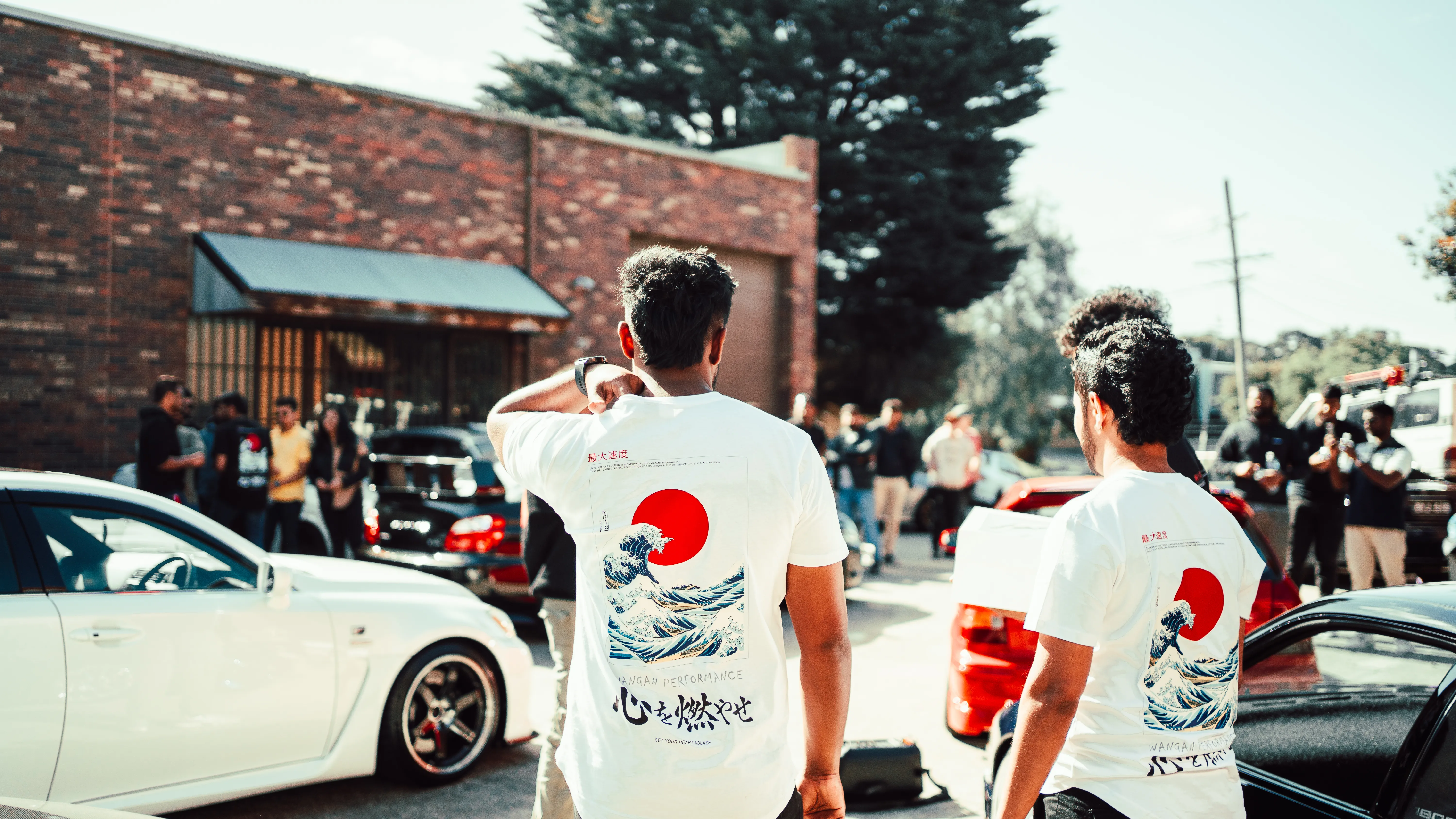 Wangan Performance founders at a Melbourne car meet wearing Great Wave shirts